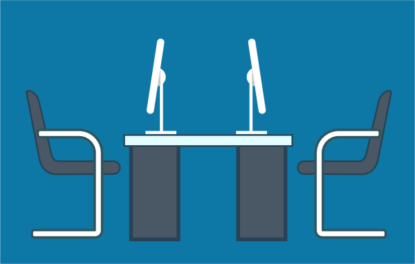 Two computer workstations facing eachother.