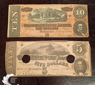 Two Confederate notes: a ten dollar and five dollar bill.