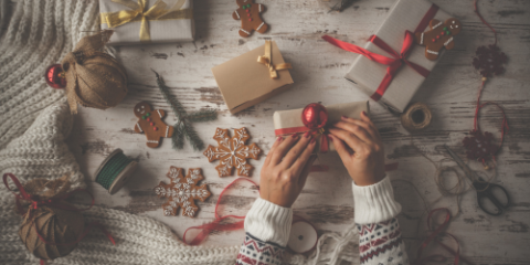 Hands wrapping gifts