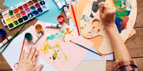 hands and art supplies