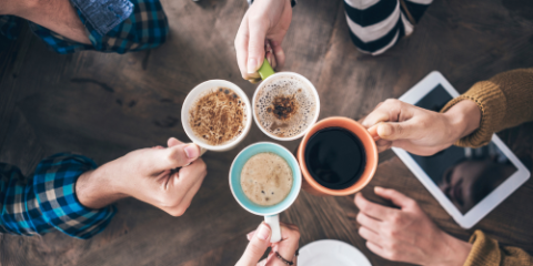 Hands holding coffee