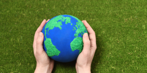 hands holding the planet Earth