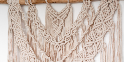 close up of woven string art