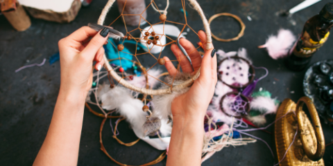 Photo of a woman making a dreamcatcher