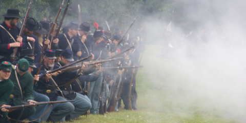 Union soldier reenactors firing rifles