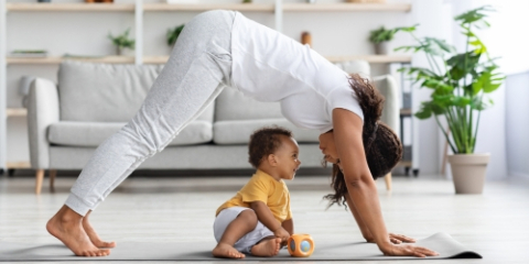 Mom and toddler doing yoga together