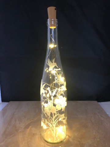 glowing fairy wine bottle with little lights