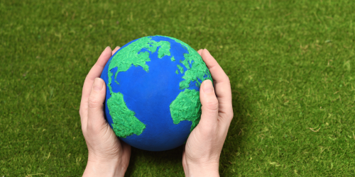 hands holding the planet Earth