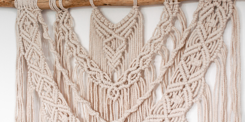 close up of woven string art