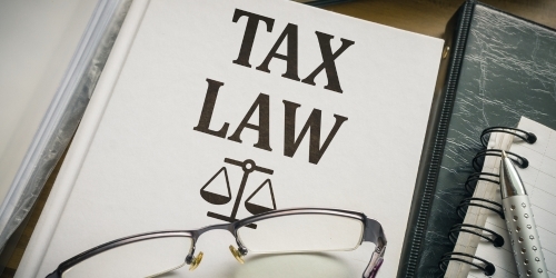 paper with 'tax law' graphic