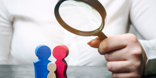 family being examined by a magnifying glass