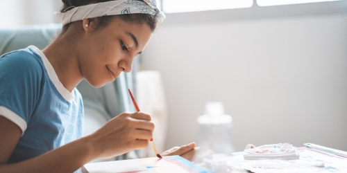 Teen doing artwork
