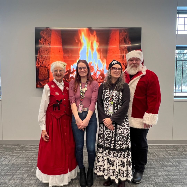 Youth Services Staff with Santa and Mrs. Claus