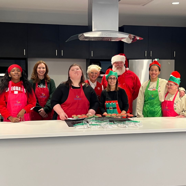 Geneva kitchen, Santa and attendees at 2025 Geneva holiday program